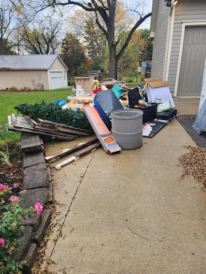 Dumpster being loaded with debris for 12 Yard Dumpster Rental in Port Arthur